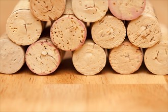 Stack of wine corks on a wood surface