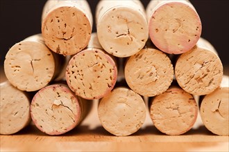 Stack of wine corks on a wood surface