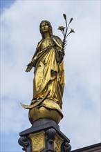 Figure of the Virgin Mary on the town hall fountain