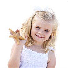 Adorable little blonde girl with starfish isolated on a white background