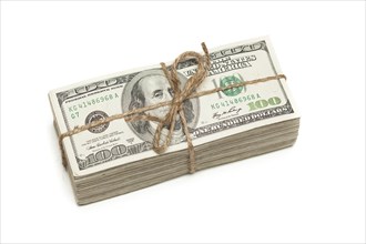 Stack of one hundred dollar bills tied in a burlap string isolated on a white background