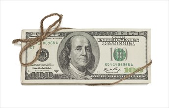 Stack of one hundred dollar bills tied in a burlap string isolated on a white background