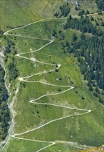 Zigzag hiking trail on a mountain slope