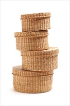 Stack of various sized wicker baskets isolated on white