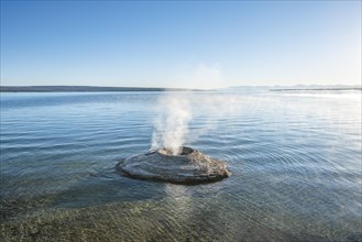 Steaming fumarole in lake