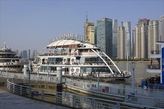 View from a pier across the Huangpu River to the skyline of the Pudong Special Economic Zone