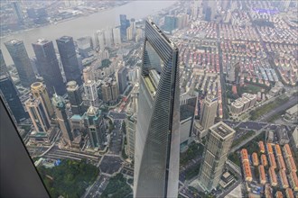 View from the highest observatory of the world on 562 meters height in the 632 meters high skyscraper Shanghai Tower to the special economic zone Pudong with the 492 meters high Shanghai World Financi...