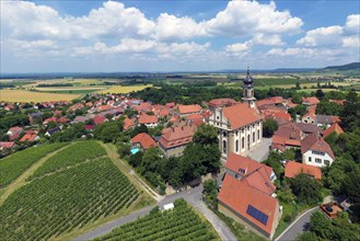 Village center wine village Castell with county church St. Johannes and vineyard Schlossberg