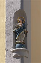 Sculpture of Maria immaculata on a corner house