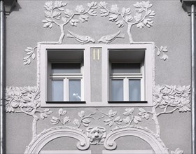 Floral art nouveau reliefs on a residential house from 1908