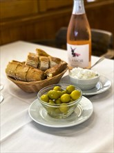 Olives with white bread and wine