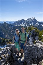 Two hikers on the summit of Breitenstein
