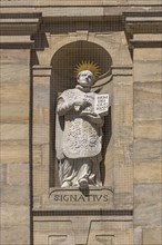 Sculpture of Ignatius of Loyola on the main facade of the parish church of St.Martin