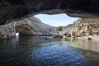 Cauldron-like rock walls of the collapsed cave Sykia