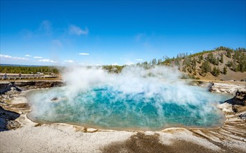 Hot spring with steaming turquoise water