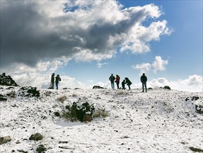 Tourists in snowy landscape