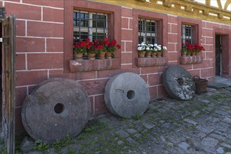 Old millstones in front of the flour mill