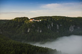 View from Eichfelsen to Wildenstein Castle with morning fog