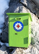 Donation box of the mountain rescue service at a mountain