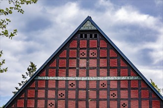 Half-timbered house in the round village of Satemin
