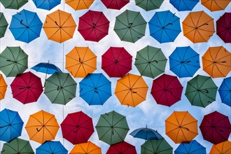 Umbrellas over shopping street