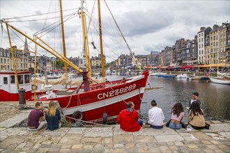 Tourists in the old port of Honfleur