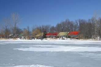 Colourful cottages along the frozen Saint Lawrence River