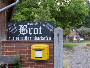 Letterbox and sign for selling bread in the Rundlingsdorf Luebeln