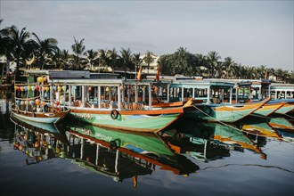 Colorful tourist boats on the river in Hoi An