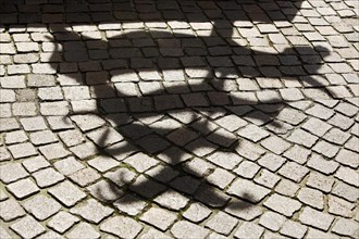 Shadows on the pavement of the Bremen Town Musicians