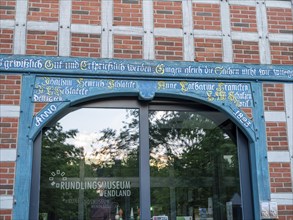 Entrance gate with old saying at the Rundlingsmuseum Wendland in the Rundlingsdorf Luebeln