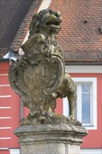 Lion with princely coat of arms as fountain figure on the Luitpoldplatz