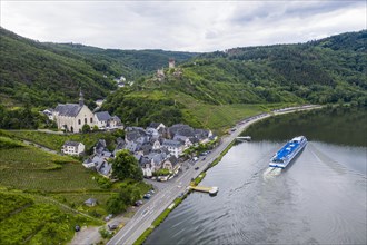 Cruise ship passing Beilstein on the Moselle with Metternich castle