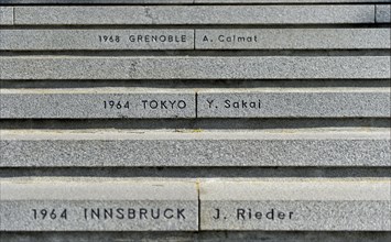 Stairs to the Olympic Museum with the venues of the Olympic Games and the names of the last torchbearer