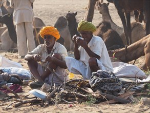 Two men taking a break at the camel market of Pushkar