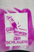 Pink stencil on a house wall