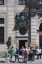 West front of the Residenz with tourist group during city tour