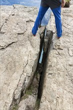 Person standing on crevice