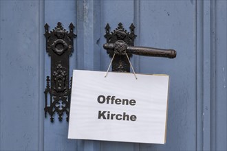 Open Church sign on the portal of the Protestant Church of St. Johannis in Luechow