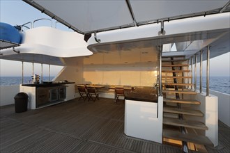 Upper deck with buffet and stairs to the top deck