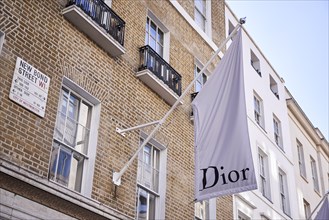 Dior flag on old house wall