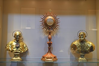 Golden monstrance and holy figures
