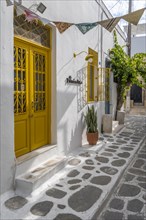 Cycladic house with yellow door