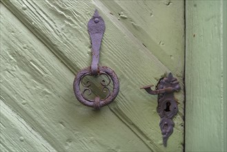 Old door knocker and door handle around 1520