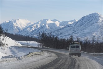 Minivan driving on the Road of Bones