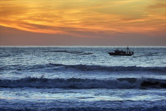 Fishing boat in the surf