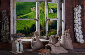 View from the farmer's kitchen with grain sacks and scales into the landscape