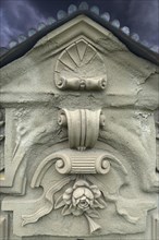 Ornaments and symbol of a rose on a gravestone