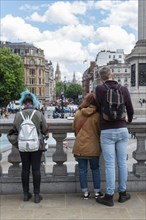 Young people standing in Trafalgar Square