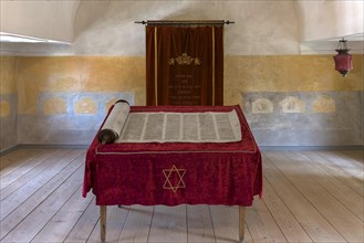 Table with Torah scroll and Torah cupboard in the synagogue in the Judenhof